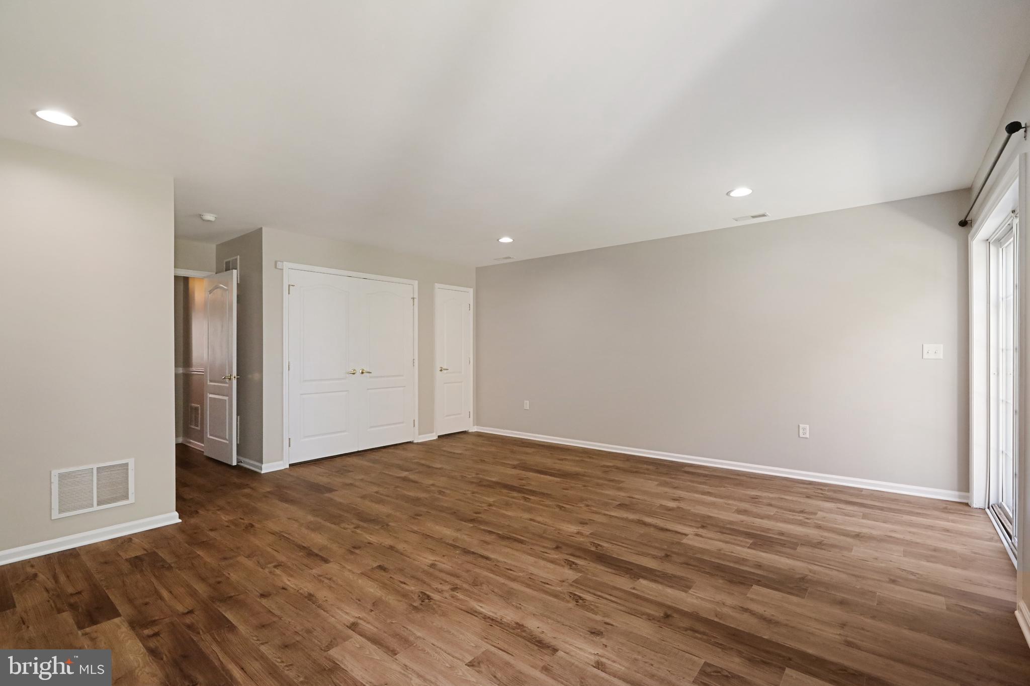 1041 Buckingham Thorofare, NJ 08086 - Photo 8 of 35 a view of an empty room with wooden floor