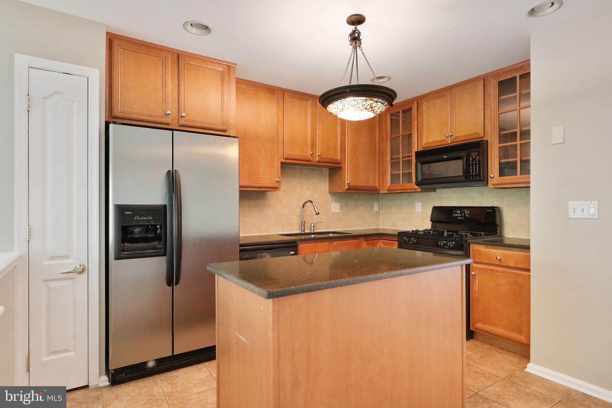 1041 Buckingham Thorofare, NJ 08086 - Photo 10 of 35 a kitchen with stainless steel appliances granite countertop a refrigerator a stove a sink and a refrigerator