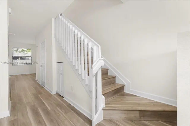 a kitchen with stainless steel appliances kitchen island sink refrigerator and stove
