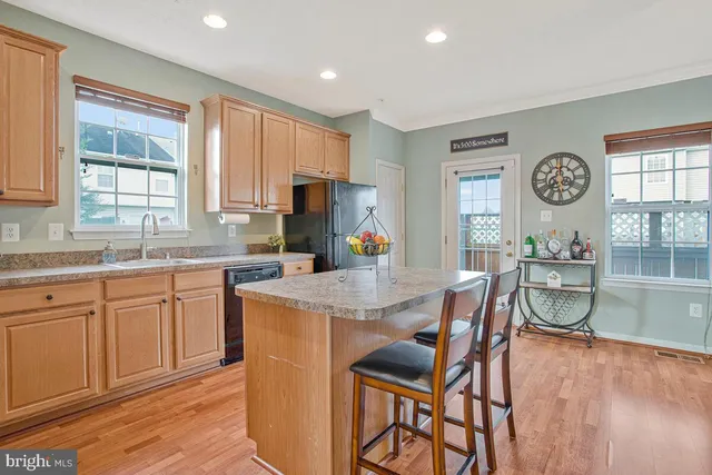 a kitchen with a table chairs stove and microwave