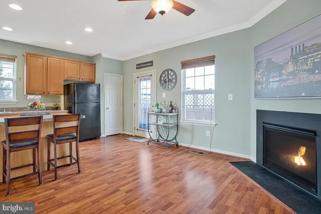 a view of livingroom with hardwood floor and a fireplace