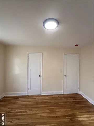 a view of a livingroom with wooden floor
