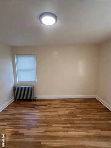 a view of room with floor to ceiling window