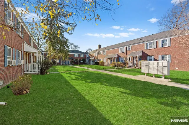a view of yard with swimming pool and green space