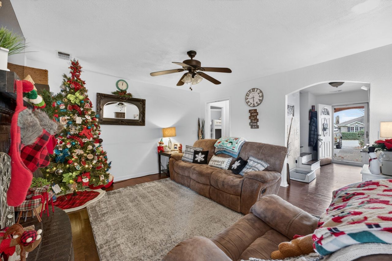 6045 Firelight Trail Antioch, TN 37013 - Photo 11 of 47 a living room with furniture and a chandelier