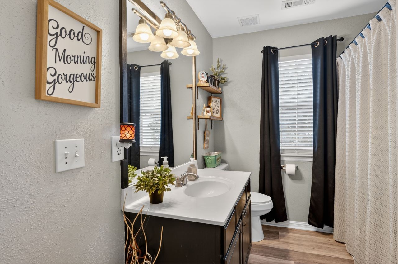 6045 Firelight Trail Antioch, TN 37013 - Photo 17 of 47 a bathroom with a sink and a mirror