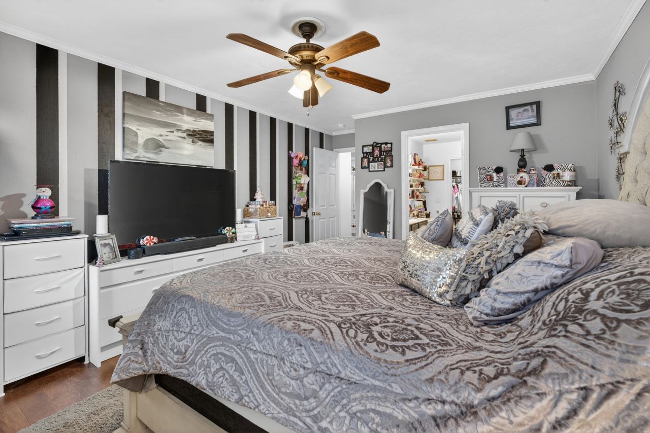 6045 Firelight Trail Antioch, TN 37013 - Photo 25 of 47 a bedroom with a bed and a flat screen tv