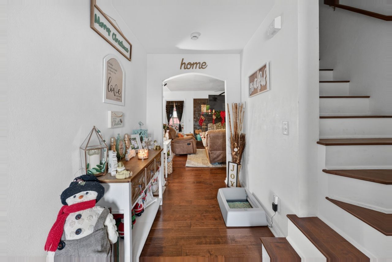 6045 Firelight Trail Antioch, TN 37013 - Photo 29 of 47 a hallway with furniture and a wooden floor