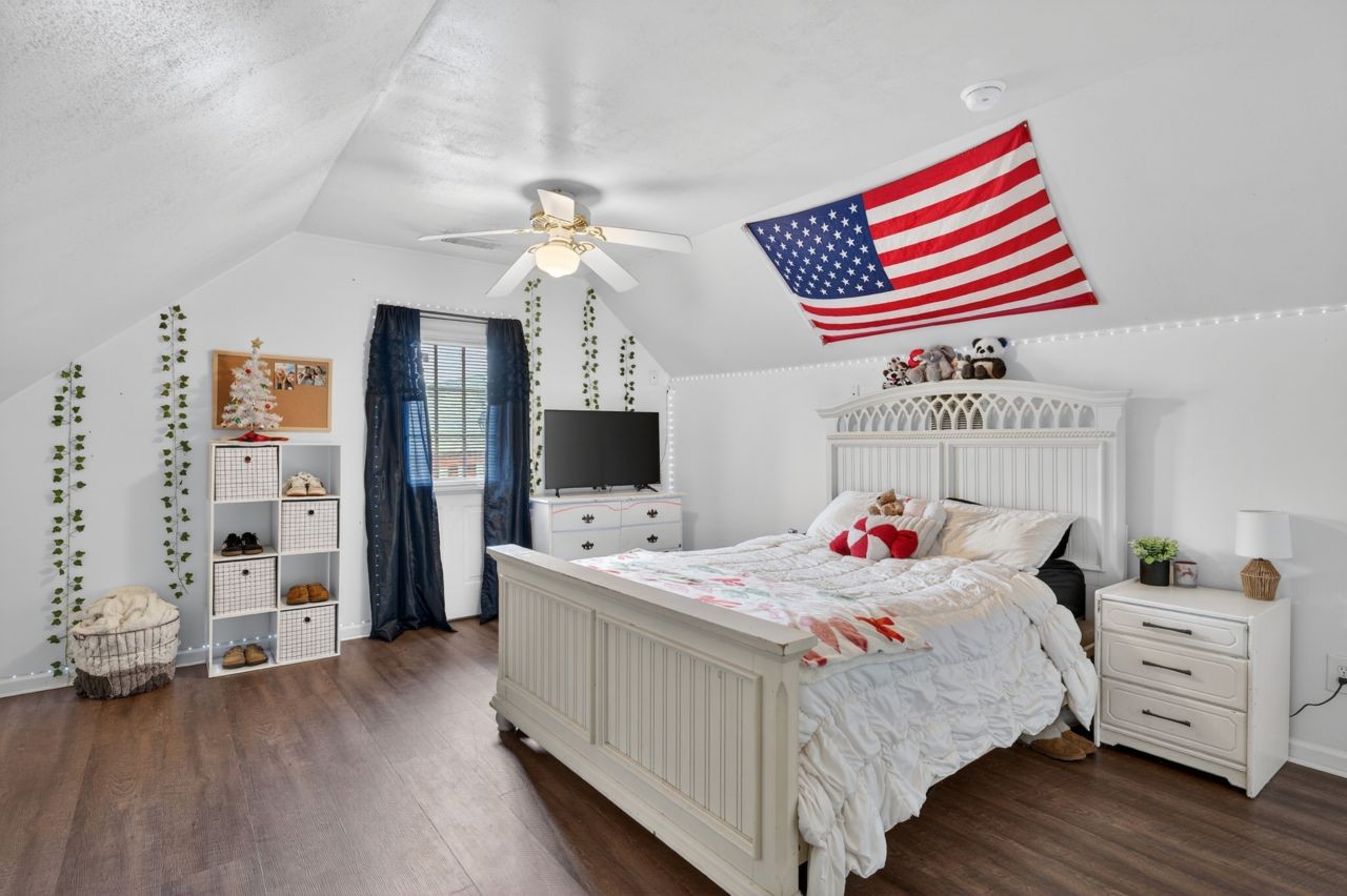 6045 Firelight Trail Antioch, TN 37013 - Photo 30 of 47 a bedroom with a bed and a television