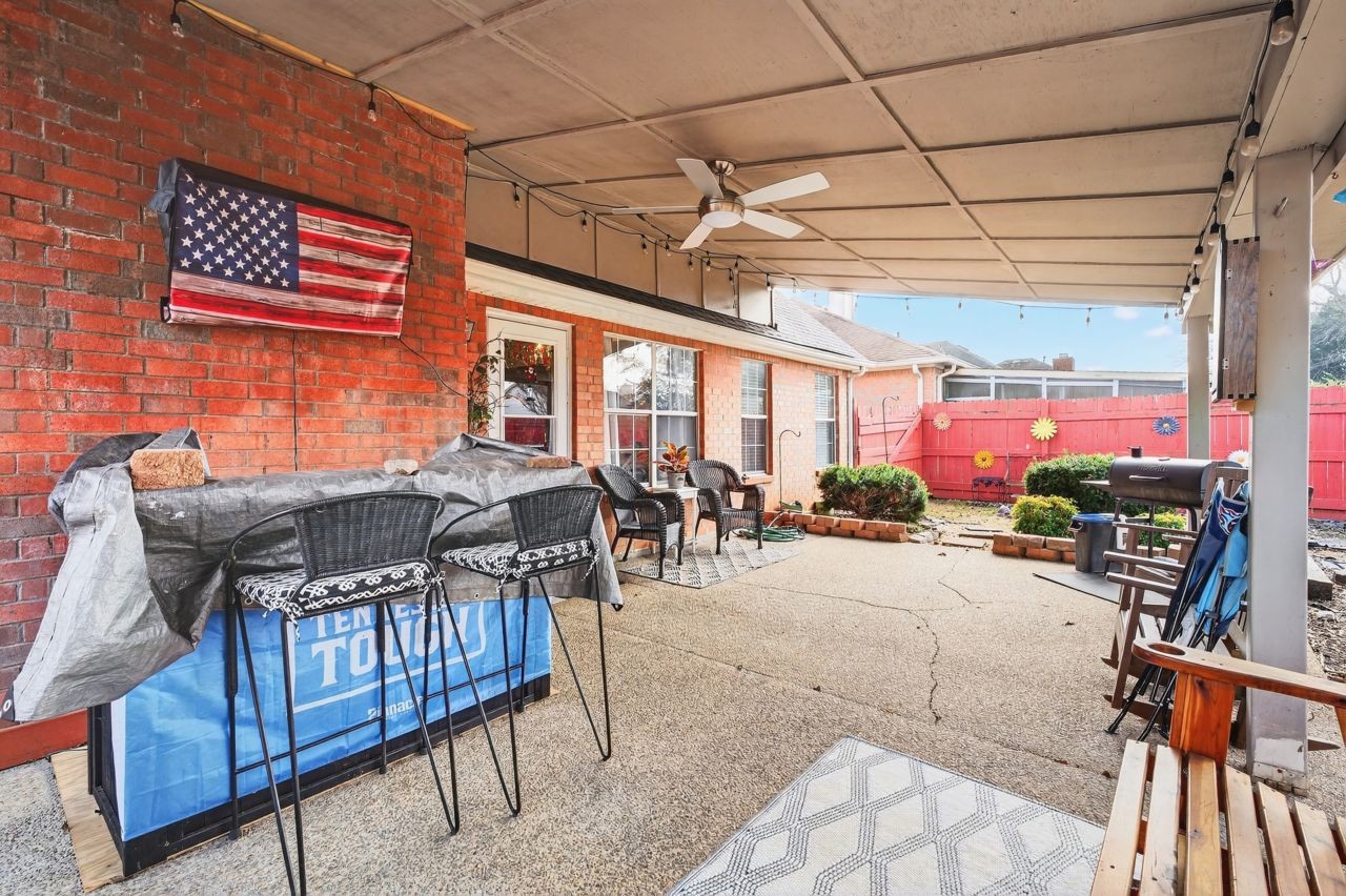 6045 Firelight Trail Antioch, TN 37013 - Photo 37 of 47 a view of a patio with a table and chairs
