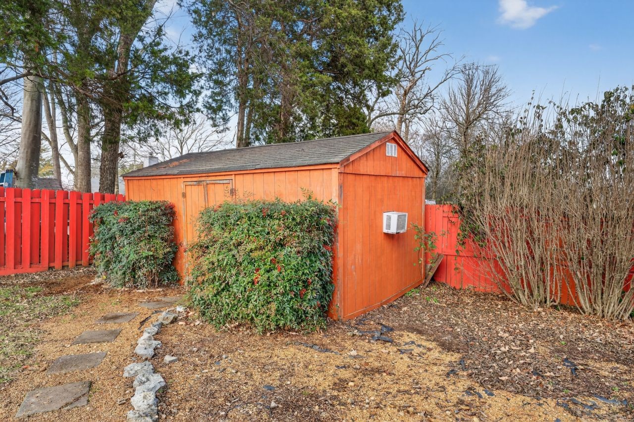 6045 Firelight Trail Antioch, TN 37013 - Photo 38 of 47 a view of backyard with large tree and wooden fence