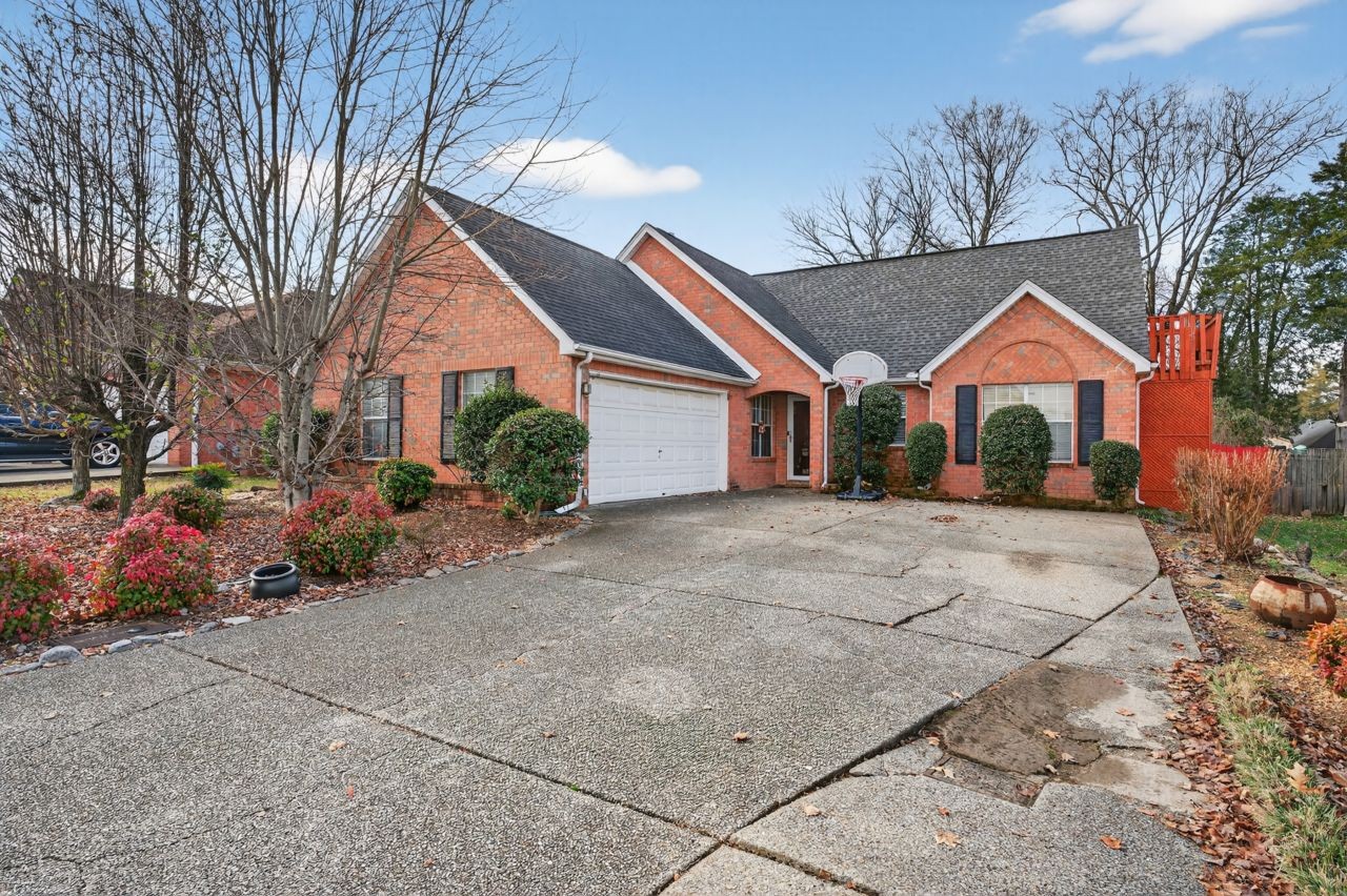 6045 Firelight Trail Antioch, TN 37013 - Photo 43 of 47 a front view of house with yard and trees around