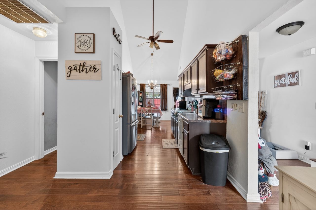 6045 Firelight Trail Antioch, TN 37013 - Photo 5 of 47 a view of a hallway with dining area and wooden floor