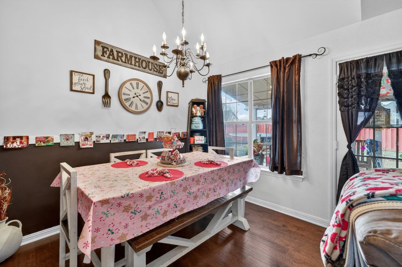 6045 Firelight Trail Antioch, TN 37013 - Photo 8 of 47 a view of a dining room with furniture window and wooden floor