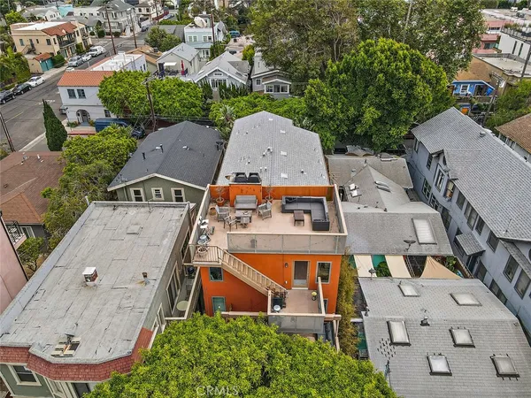 an aerial view of residential houses with outdoor space