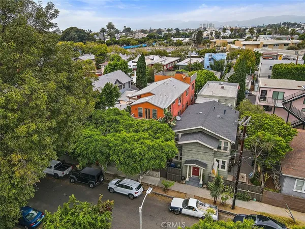 an aerial view of a house with a yard pool a patio and lake view