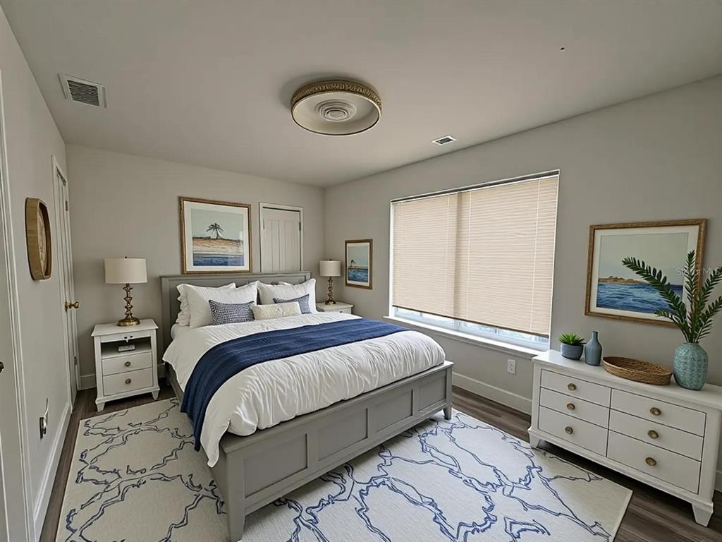 4033 Henley Road, Unit 1707 Orlando, FL 32839 - Photo 10 of 66 a bedroom with a large bed and a window