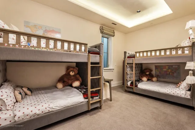 a bedroom with a bed and a tv