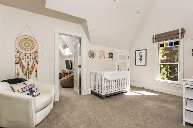 a view of a livingroom with a couch and a window