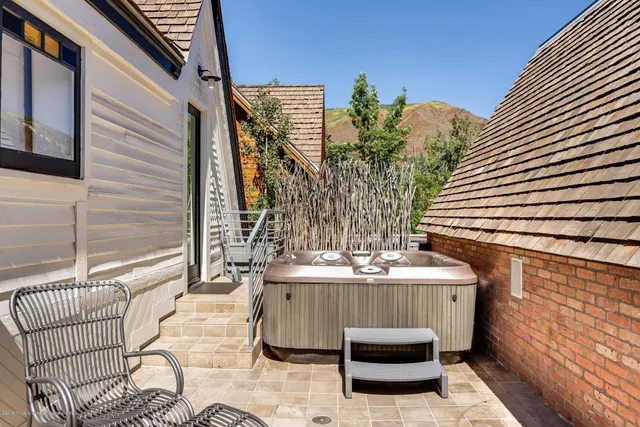 a view of a balcony with furniture