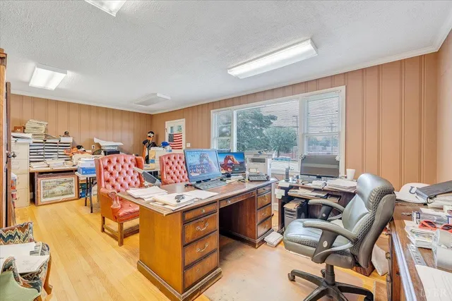 a living room with lots of furniture and a wooden floor