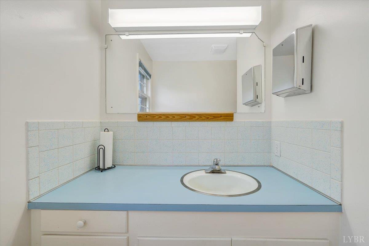 155 Laxton Road Lynchburg, VA 24502 - Photo 23 of 58 a bathroom with a sink and a mirror