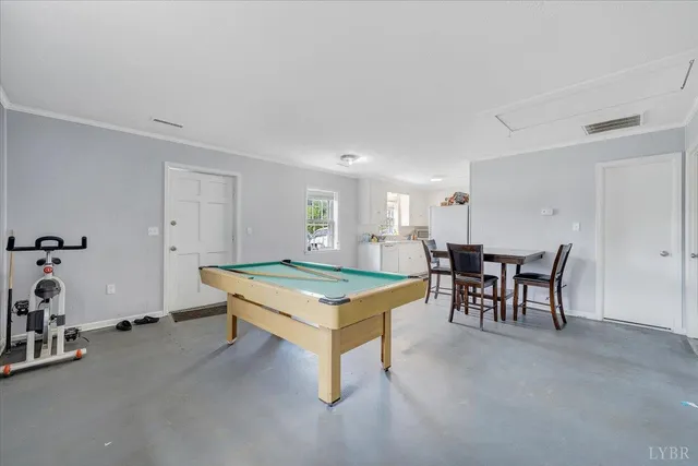 a kitchen with white cabinets appliances and a sink