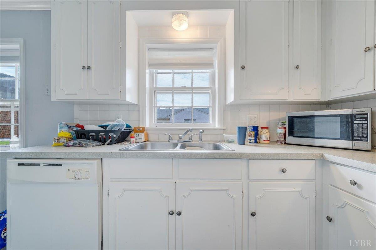 155 Laxton Road Lynchburg, VA 24502 - Photo 38 of 58 a kitchen with white cabinets and sink