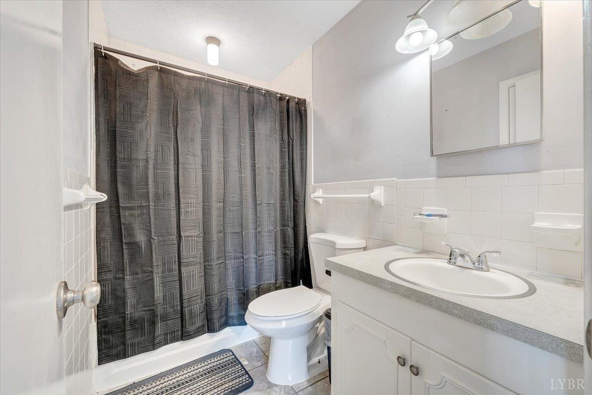 155 Laxton Road Lynchburg, VA 24502 - Photo 40 of 58 a bathroom with a sink toilet and shower