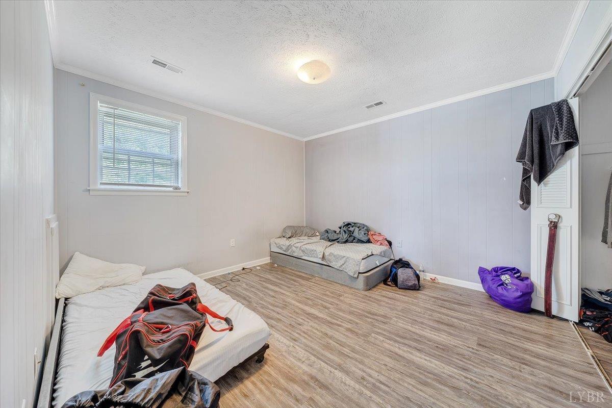 155 Laxton Road Lynchburg, VA 24502 - Photo 41 of 58 a room with furniture and a wooden floor