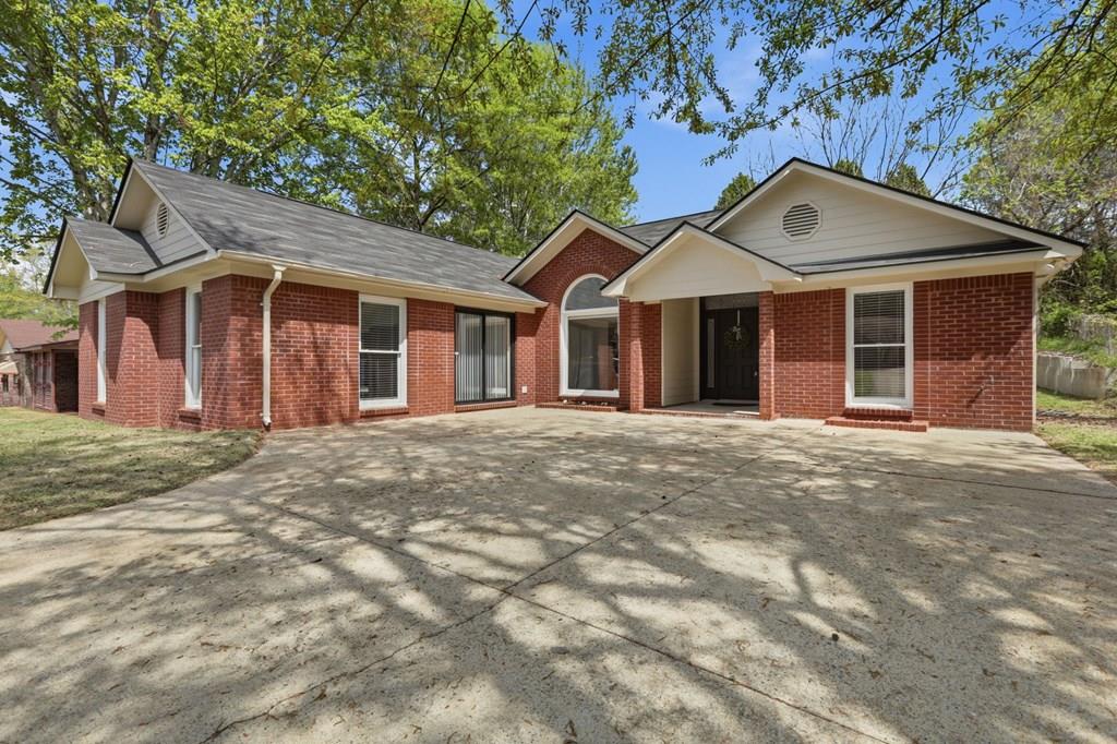 2222 Barnes Drive Columbus, GA 31907 - Photo 1 of 49 a front view of a house with a garden