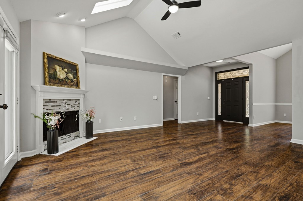 2222 Barnes Drive Columbus, GA 31907 - Photo 32 of 49 an empty room with wooden floor fireplace and windows