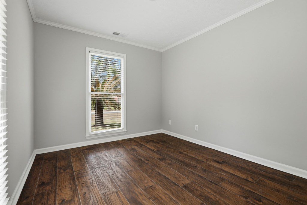 2222 Barnes Drive Columbus, GA 31907 - Photo 35 of 49 a view of an empty room with wooden floor and a window