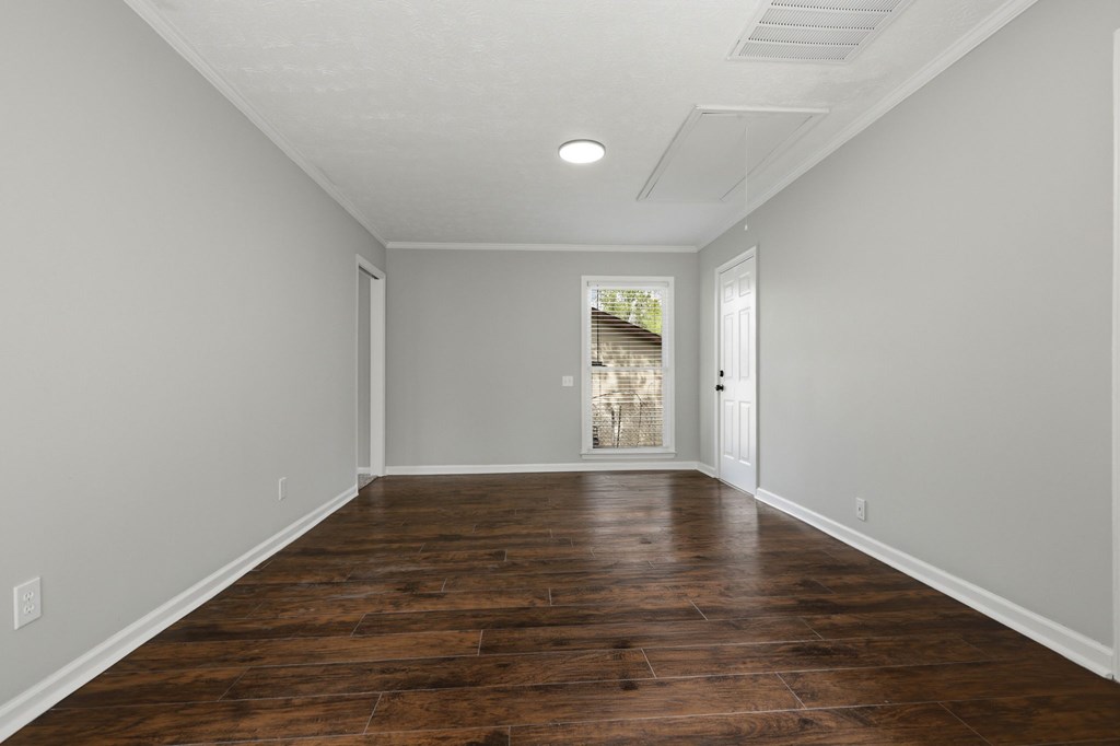 2222 Barnes Drive Columbus, GA 31907 - Photo 37 of 49 a view of an empty room with wooden floor and windows