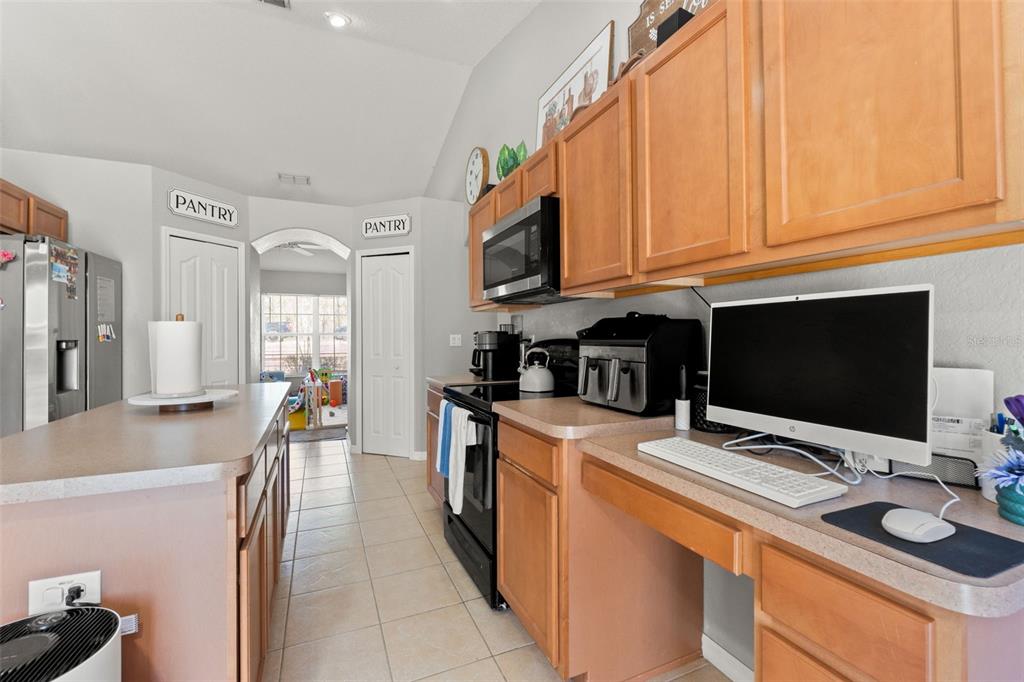 15335 Fleetwood Road Weeki Wachee, FL 34614 - Photo 24 of 40 a kitchen with stainless steel appliances granite countertop a sink and a stove