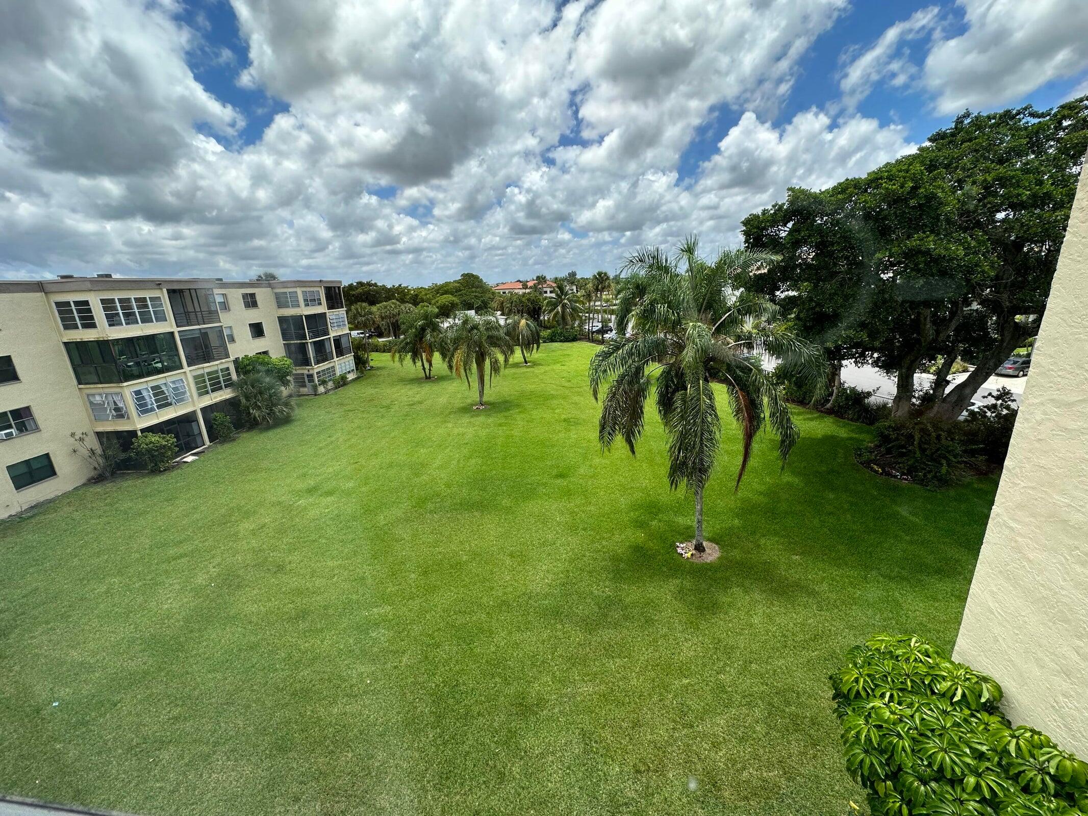 9355 Southwest 8th Street, Unit 421 Boca Raton, FL 33428 - Photo 15 of 20 a view of a garden