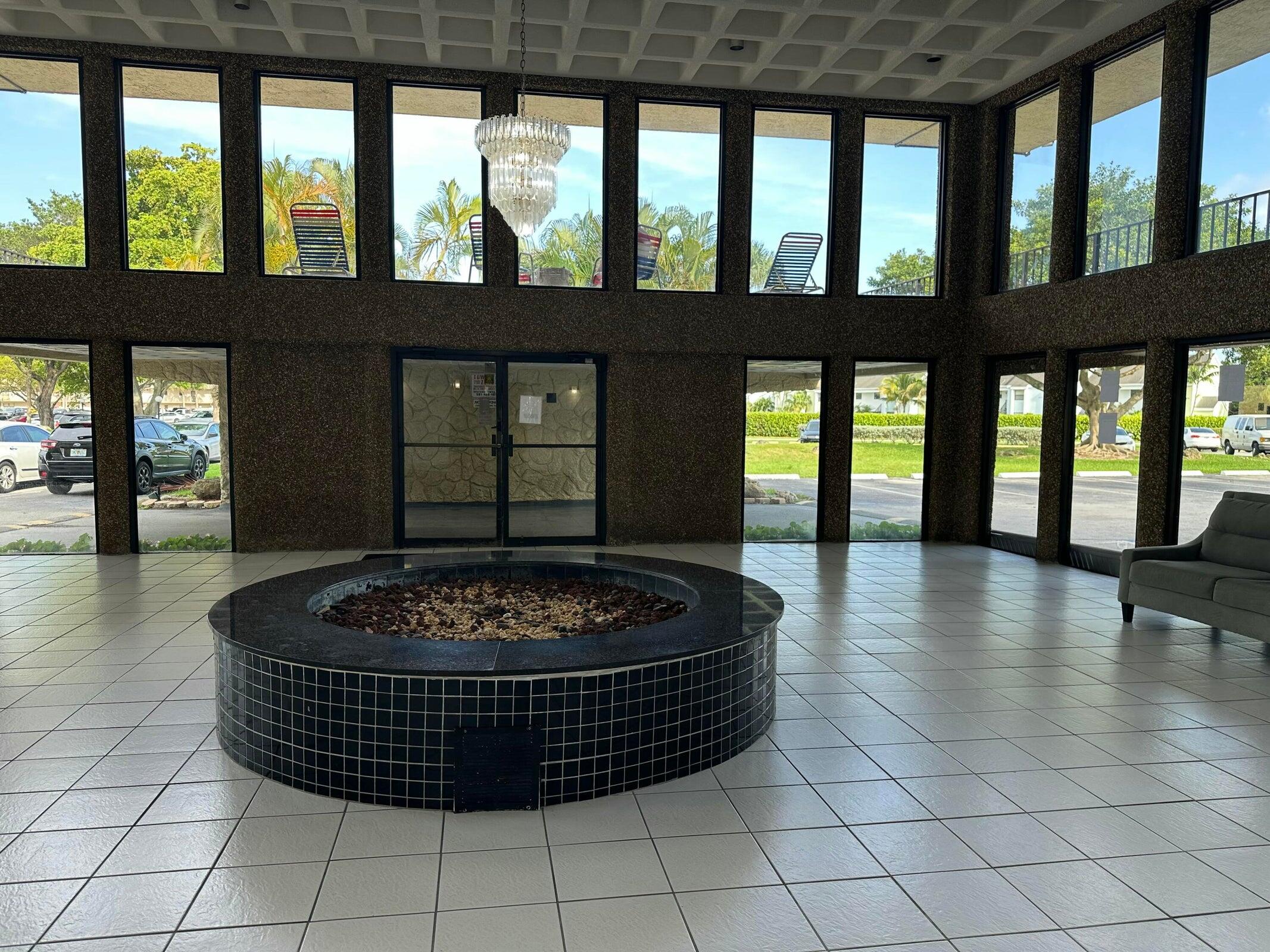 9355 Southwest 8th Street, Unit 421 Boca Raton, FL 33428 - Photo 17 of 20 a living room with a large window