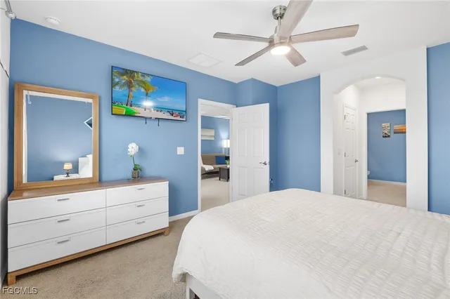 a bedroom with a bed and a dresser