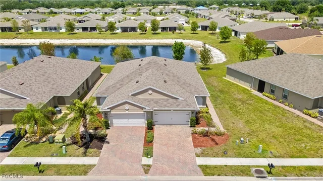 an aerial view of a house with a swimming pool