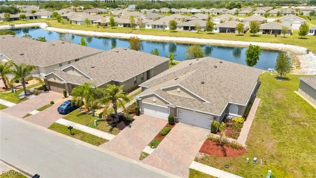an aerial view of a house with a swimming pool