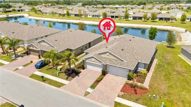 an aerial view of a house with a swimming pool