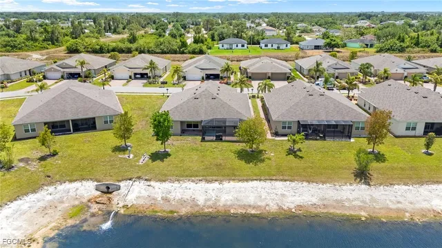 an aerial view of a house with a swimming pool yard and outdoor seating