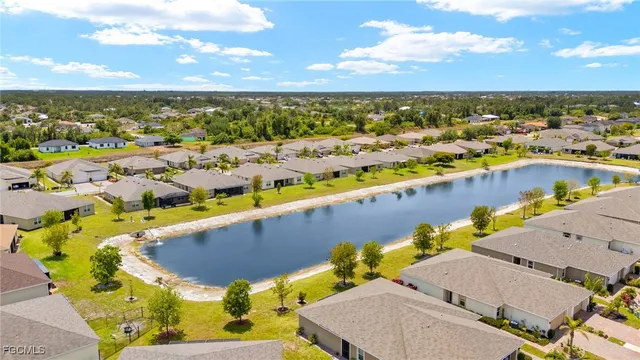 an aerial view of a house with a swimming pool