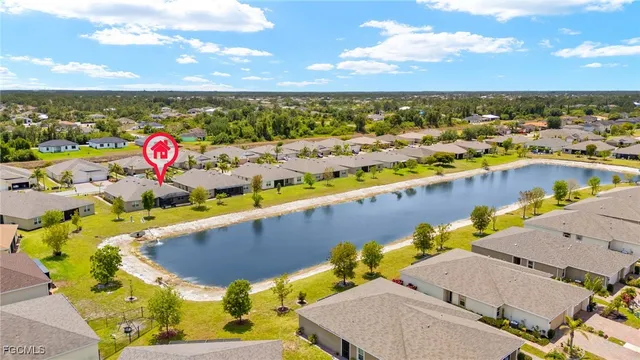 an aerial view of a house with a swimming pool