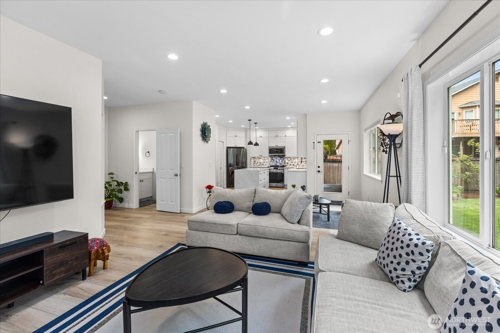 15325 Sunset Road Bothell, WA 98012 - Photo 12 of 40 a living room with furniture and a flat screen tv