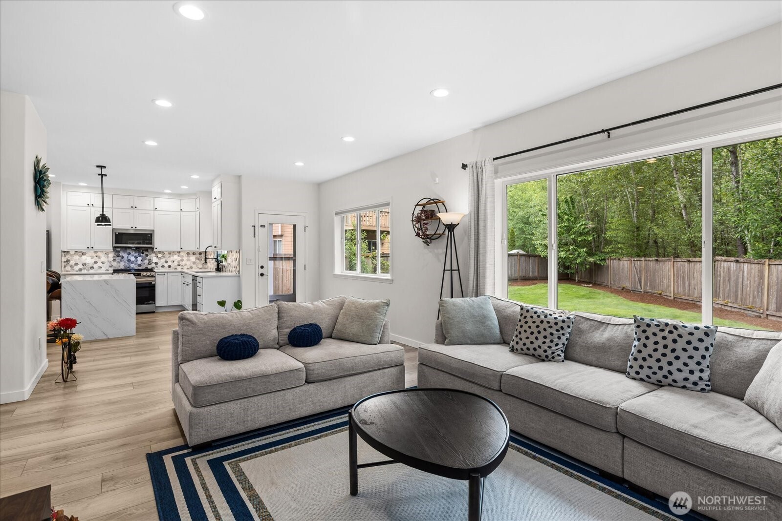 15325 Sunset Road Bothell, WA 98012 - Photo 13 of 40 a living room with furniture and a large window