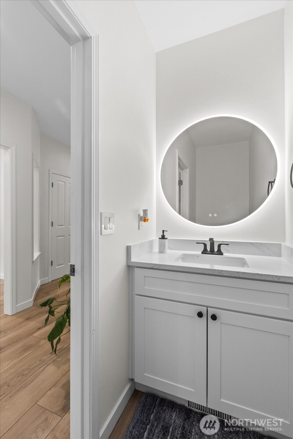 15325 Sunset Road Bothell, WA 98012 - Photo 14 of 40 a bathroom with a sink and mirror