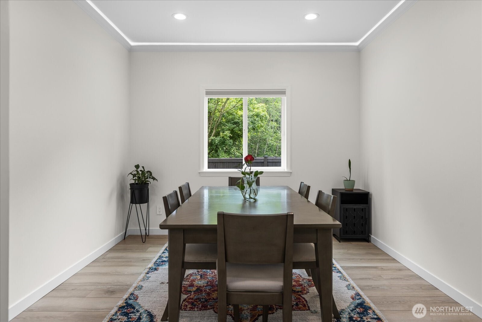 15325 Sunset Road Bothell, WA 98012 - Photo 15 of 40 a view of a dining room with furniture window and wooden floor