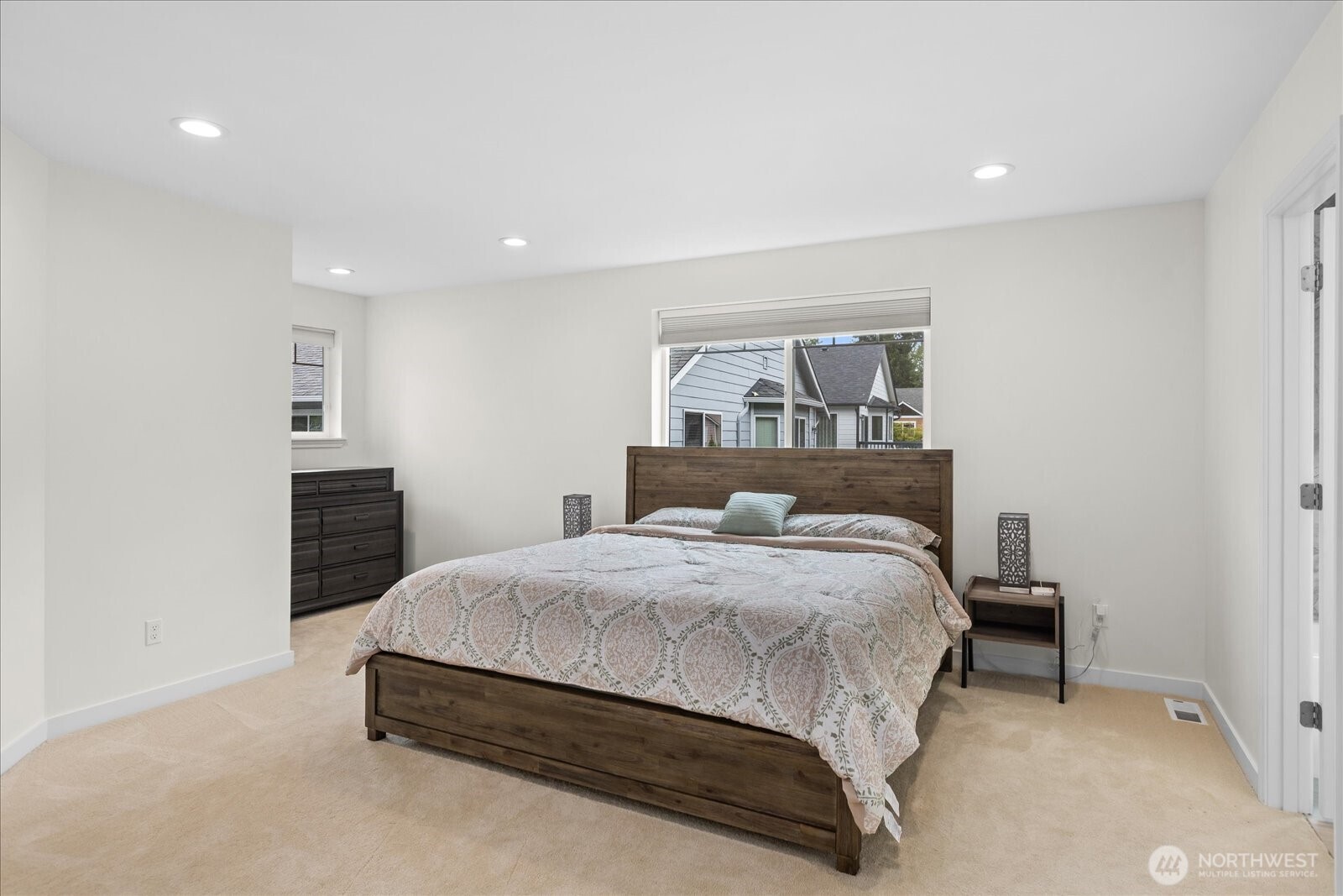 15325 Sunset Road Bothell, WA 98012 - Photo 16 of 40 a bedroom with a bed and a view of kitchen