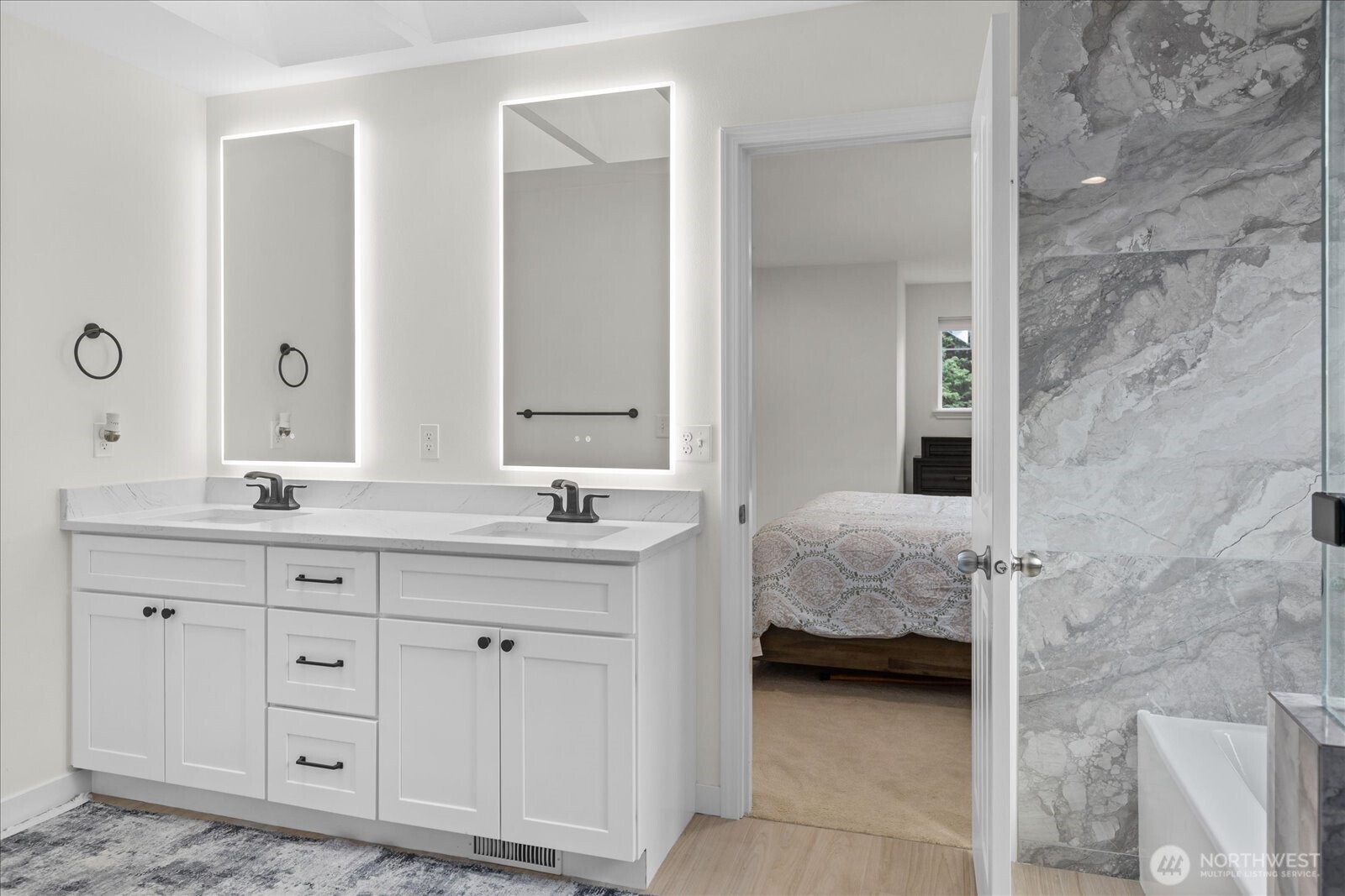 15325 Sunset Road Bothell, WA 98012 - Photo 19 of 40 a en suite bathroom with a double vanity sink and a mirror